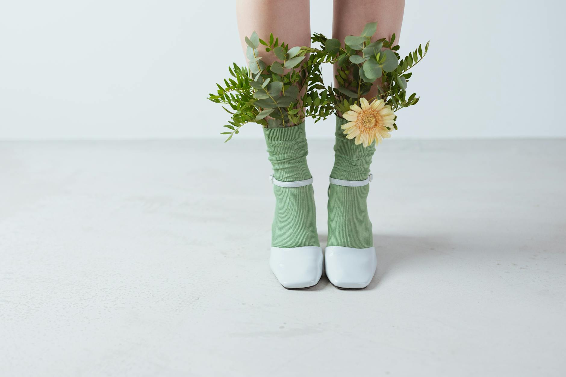 leaves and a flower on a person s socks